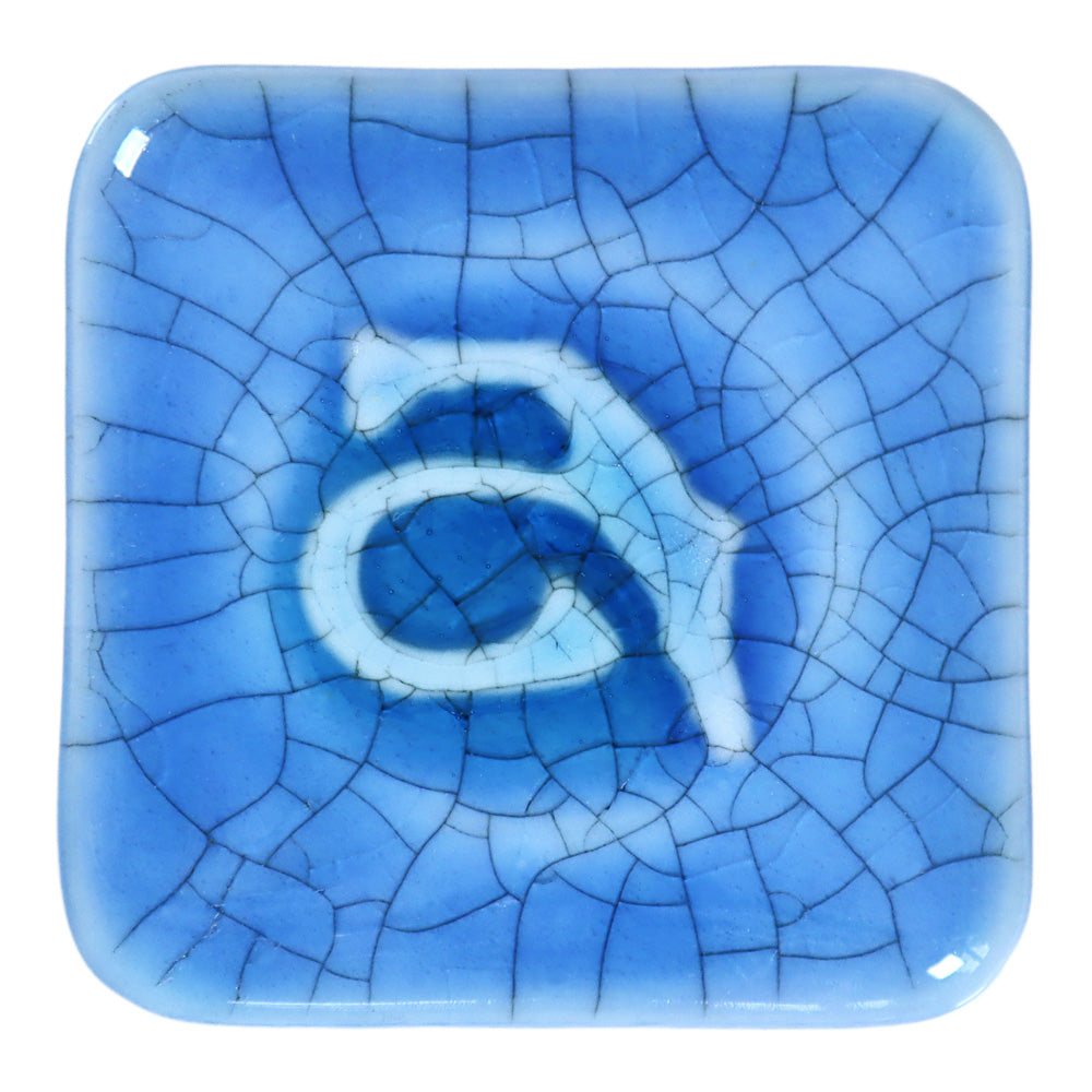 Abbots Crater Lake Crackle glaze swatch showing the glaze pools into deeper tones and softens across edges, while the crackle adds delicate surface structure.