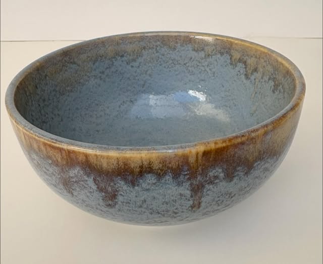 Ceramic bowl with a textured surface on a white background