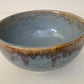 Ceramic bowl with a textured surface on a white background