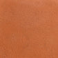 A close-up image of a textured Grog Buff Stoneware Clay surface.