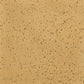 A close-up image of a speckled stoneware clay surface in a buff color.