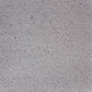 Close-up view of a textured stoneware clay surface with speckles.