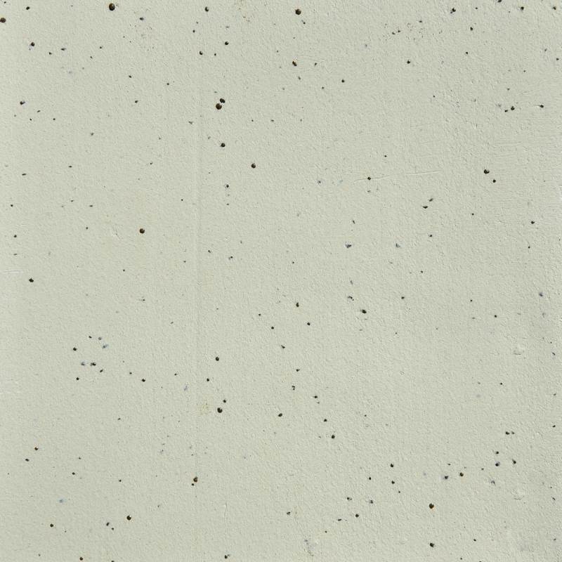 A close-up view of stoneware clay with speckles throughout, indicating a textured surface.